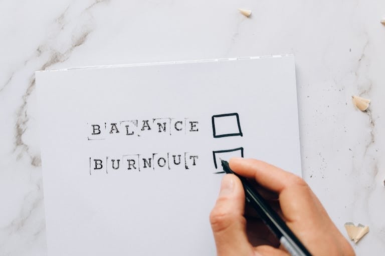 a checklist with options for balance or burnout, symbolizing stress and choice.